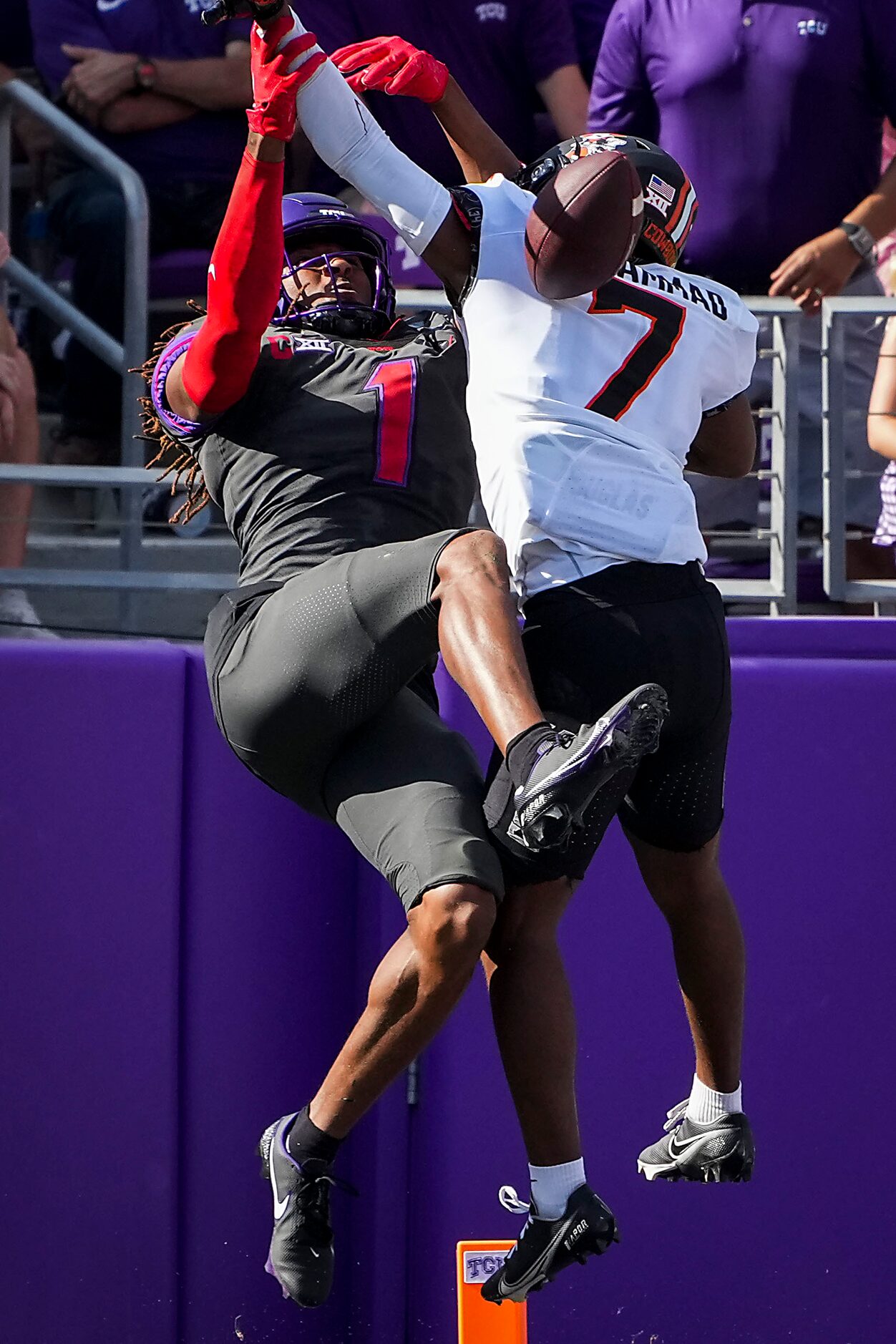 Oklahoma State cornerback Jabbar Muhammad (7) breaks up a pass intended for TCU wide...