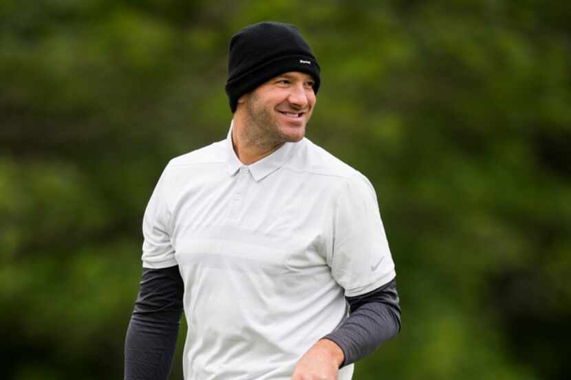 Tony Romo smiles at fans after sinking the 17th hole during round 2 of the Bryon Nelson golf...