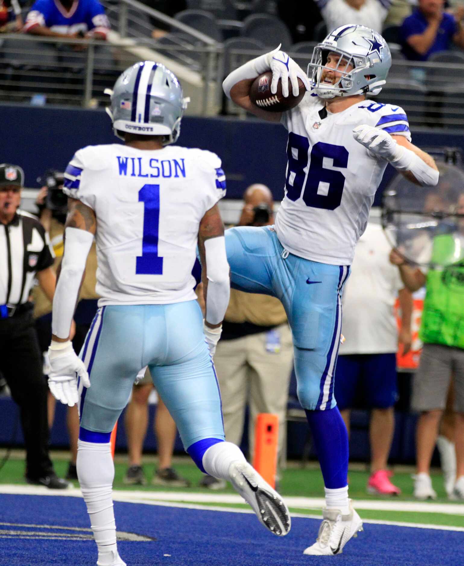 Dallas Cowboys wide receiver Cedrick Wilson (1) watches teammate tight end Dalton Schultz...