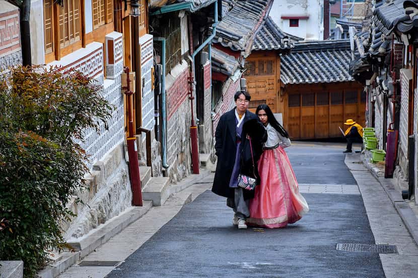 Tourists tread lightly and whisper when visiting Bukchon Hanok Folk Village in Seoul, a...