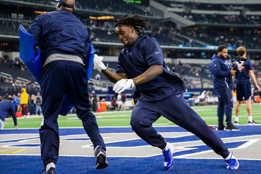 Dallas Cowboys defensive end Demarcus Lawrence (90) warms up before a Thanksgiving Day NFL...
