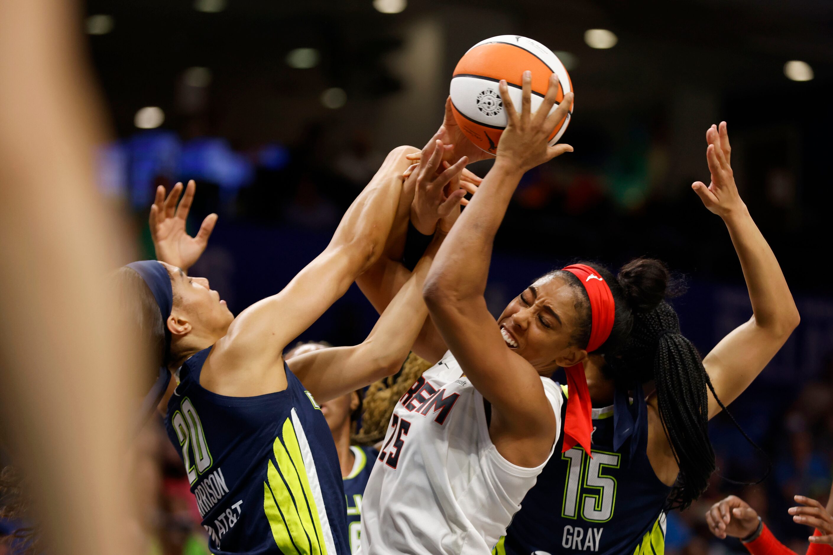 Dallas Wings forward Isabelle Harrison (20) and  guard Allisha Gray (15) defend against...