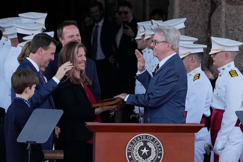 Texas Lt. Gov. Dan Patrick, right, is sworn in by District Court Judge Ryan Patrick, left,...