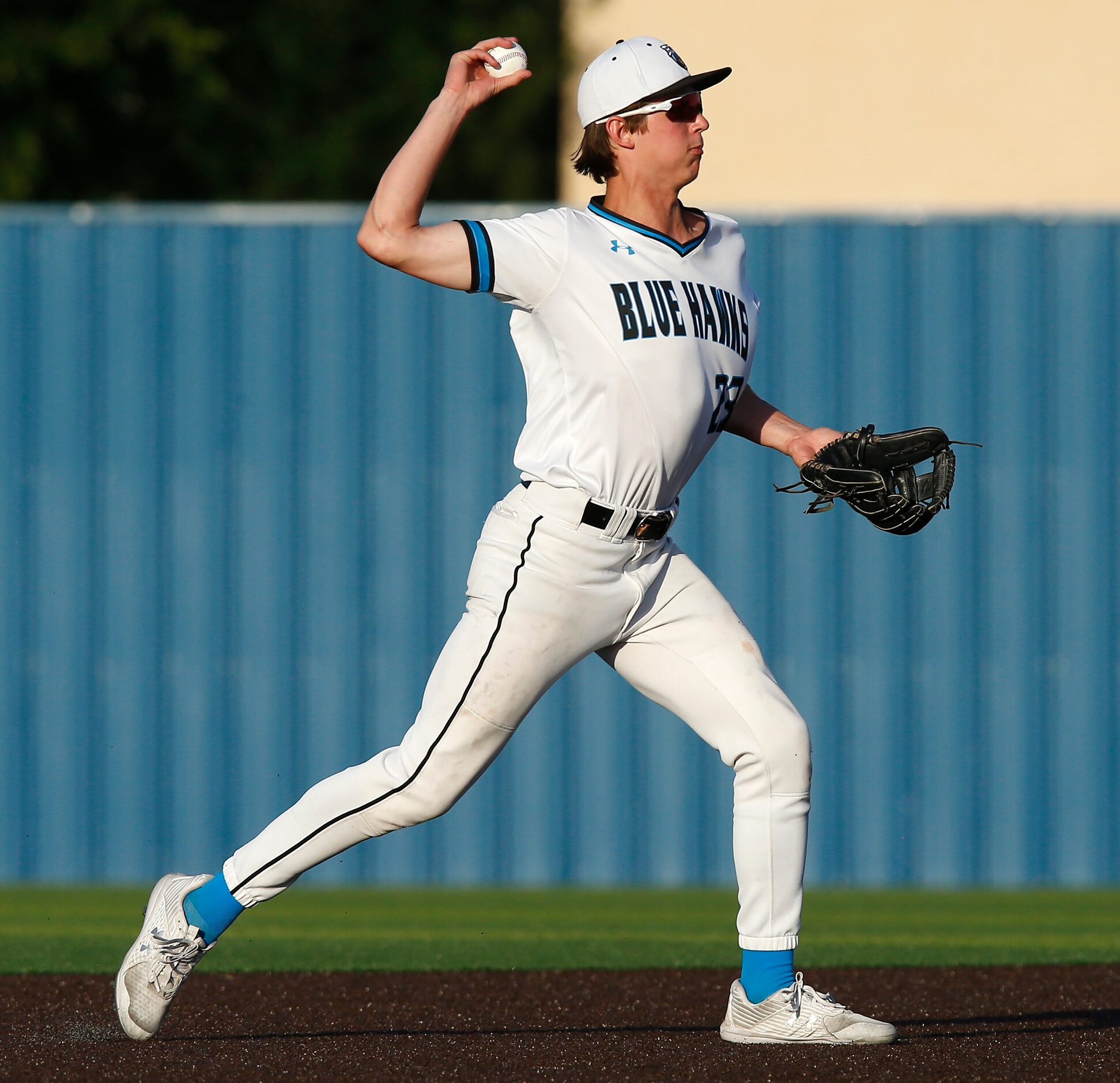 Rock Hill High School shortstop Uriah Walters (23) throws for an out in the first inning as...