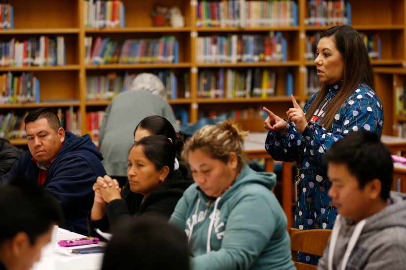 Principal Sandra Barrios talks to parents at Jack Lowe Sr. Elementary School in Dallas.