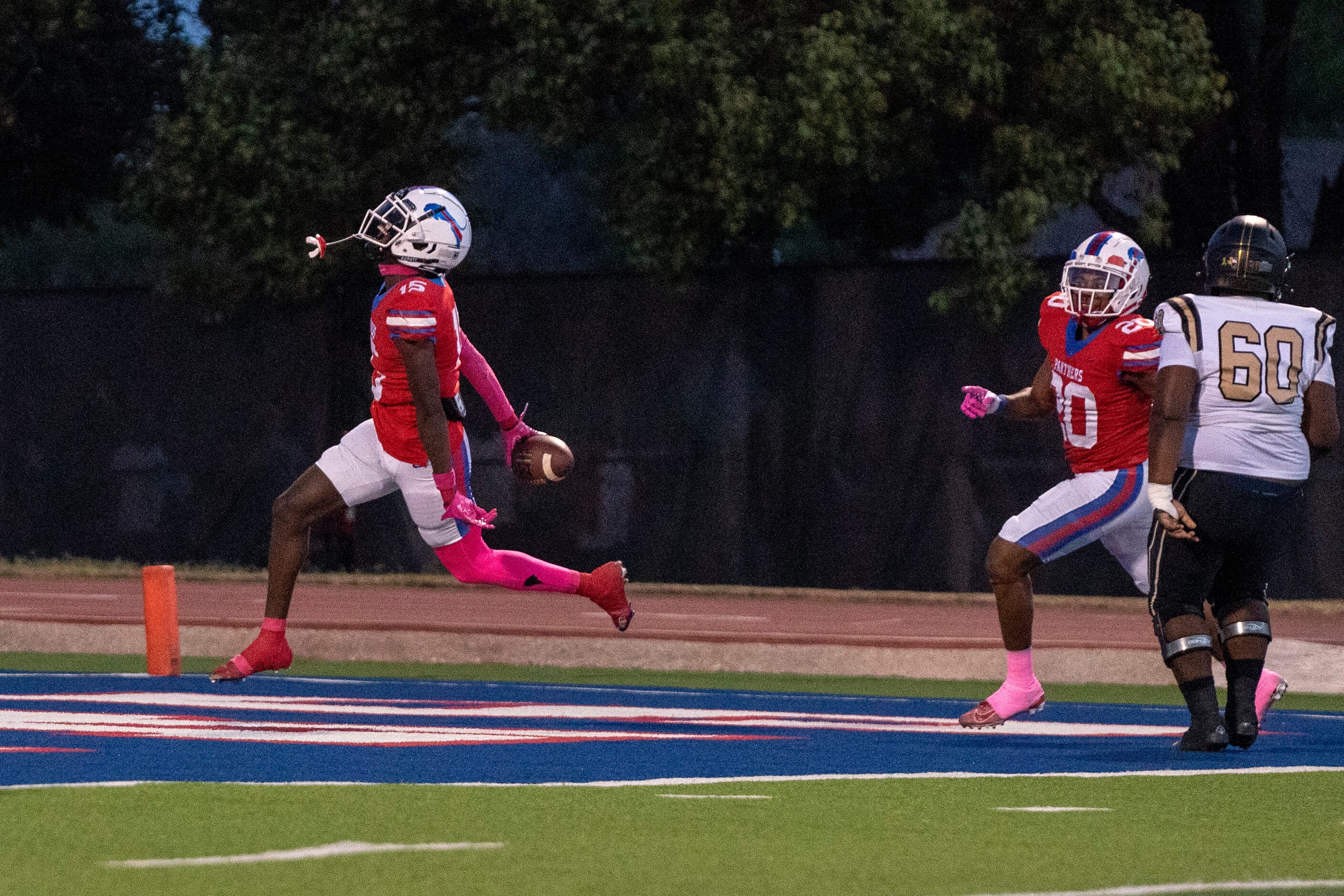 Duncanville senior defensive back Lamoderick Spencer (15) returns an interception for a...