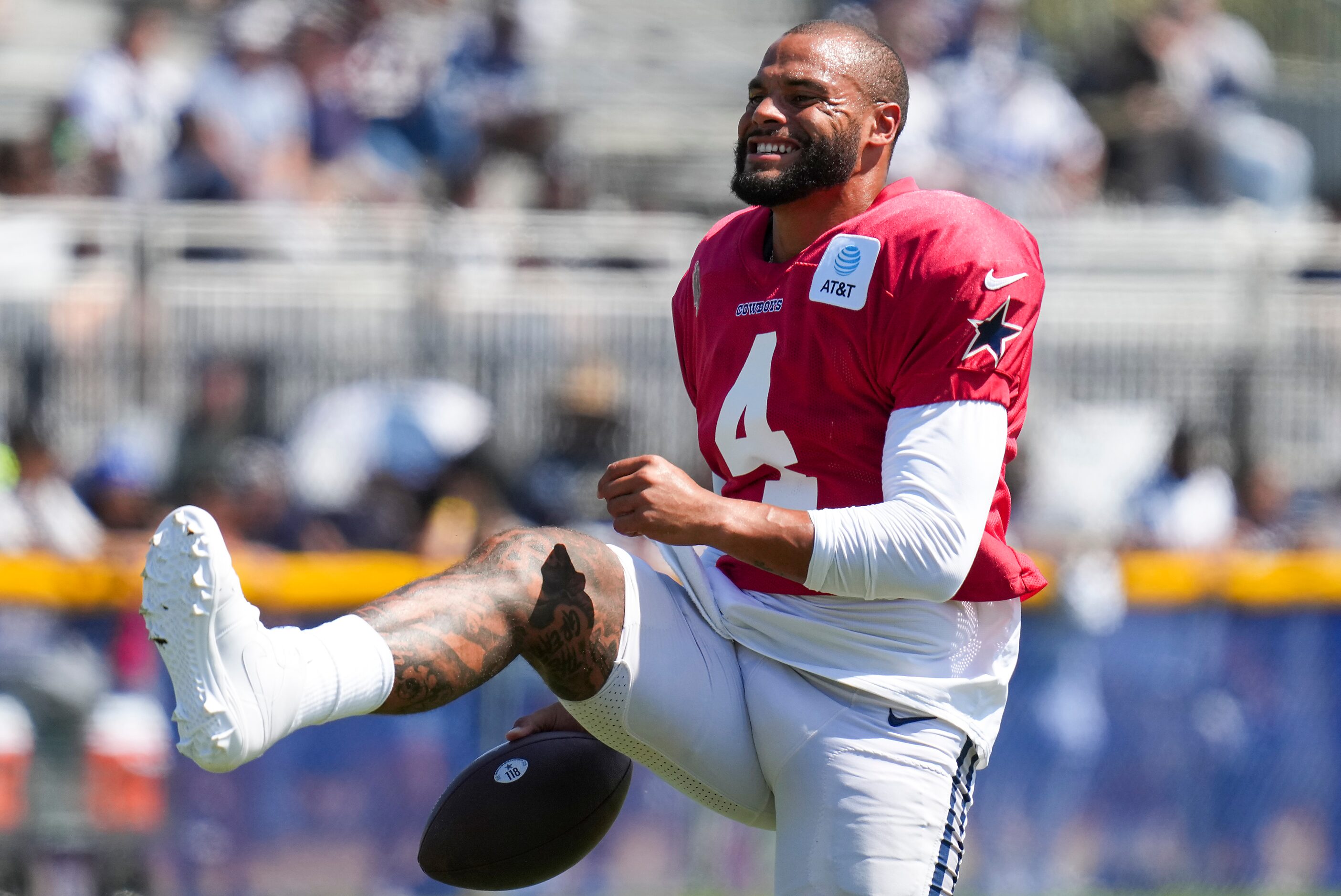 Dallas Cowboys quarterback Dak Prescott (4) stretches during a training camp practice on...