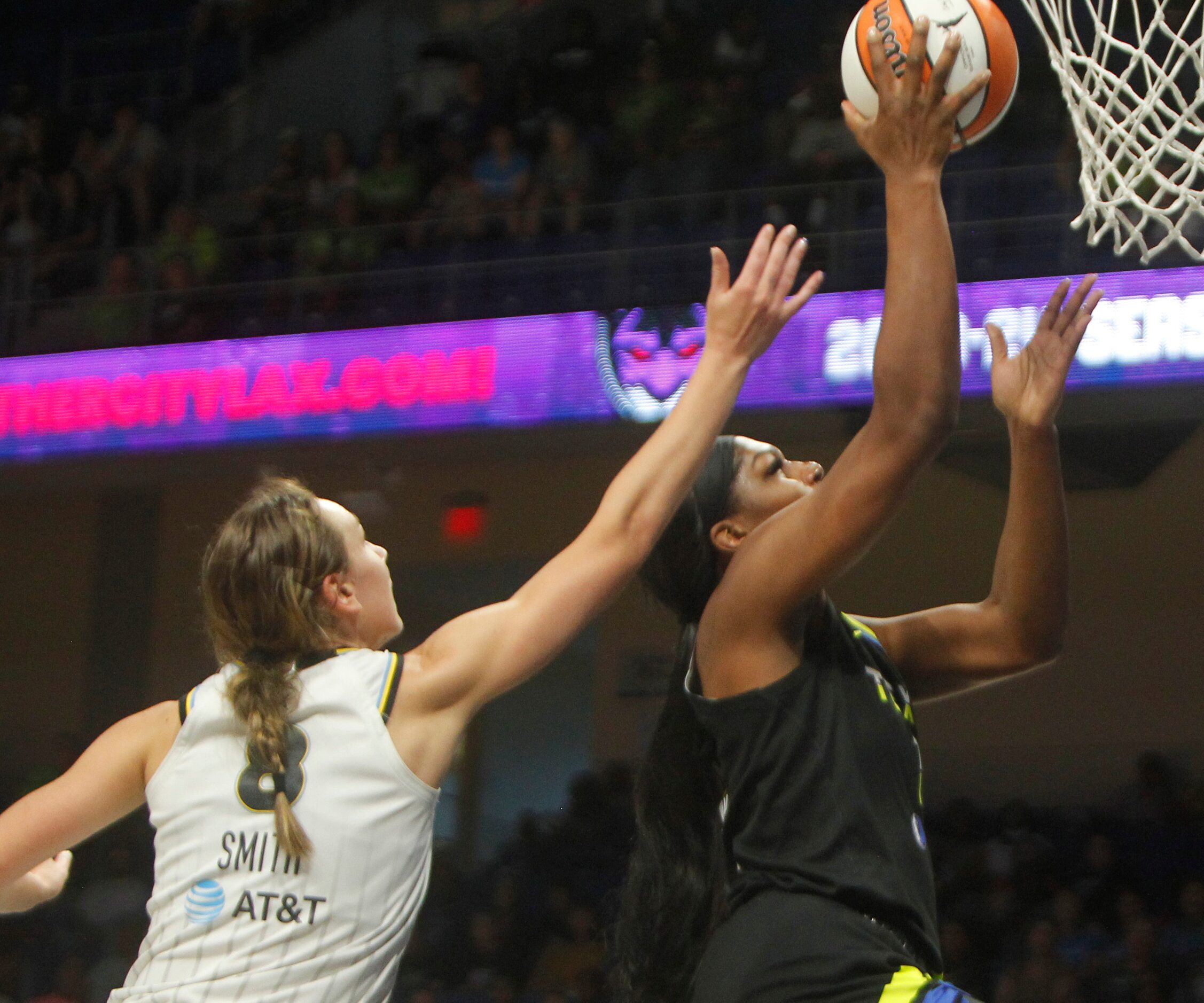 Dallas Wings center Teaira McCowan (7) scores two of her first half points as she is...