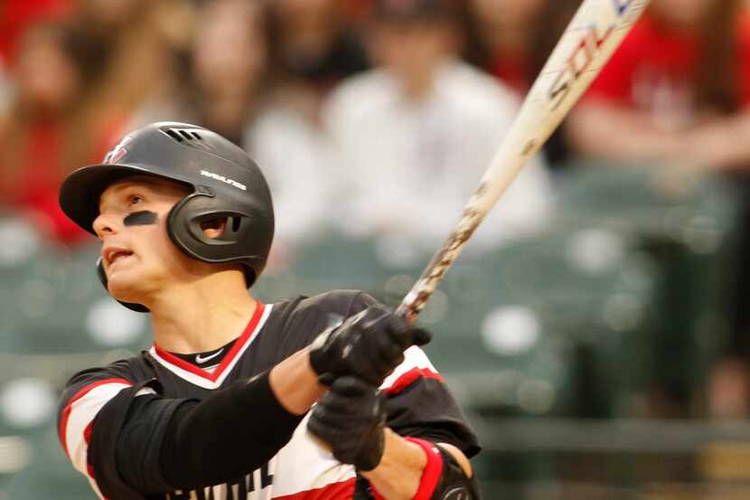 Colleyville Heritage shortstop Bobby Witt Jr. (17) watches as his towering shot to left...