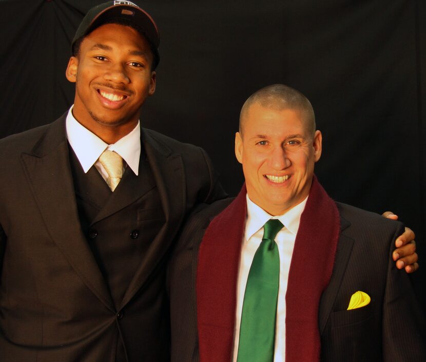 Arlington Martin defensive lineman Myles Garrett poses for a photo with Martin head football...