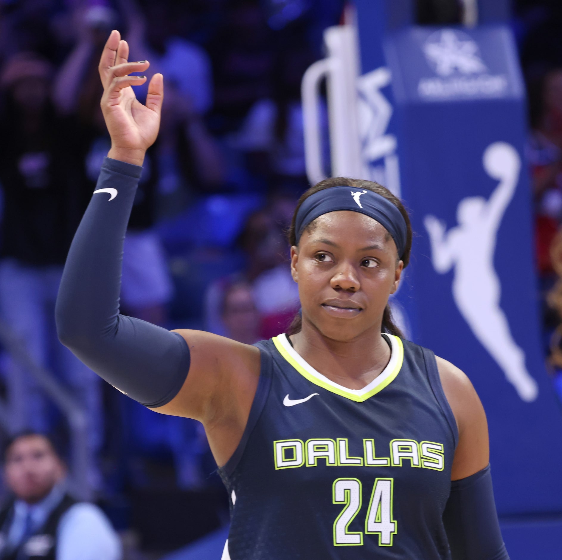 Dallas Wings guard Arike Ogunbowale (24) waves to a large crowd that gave her a standing...