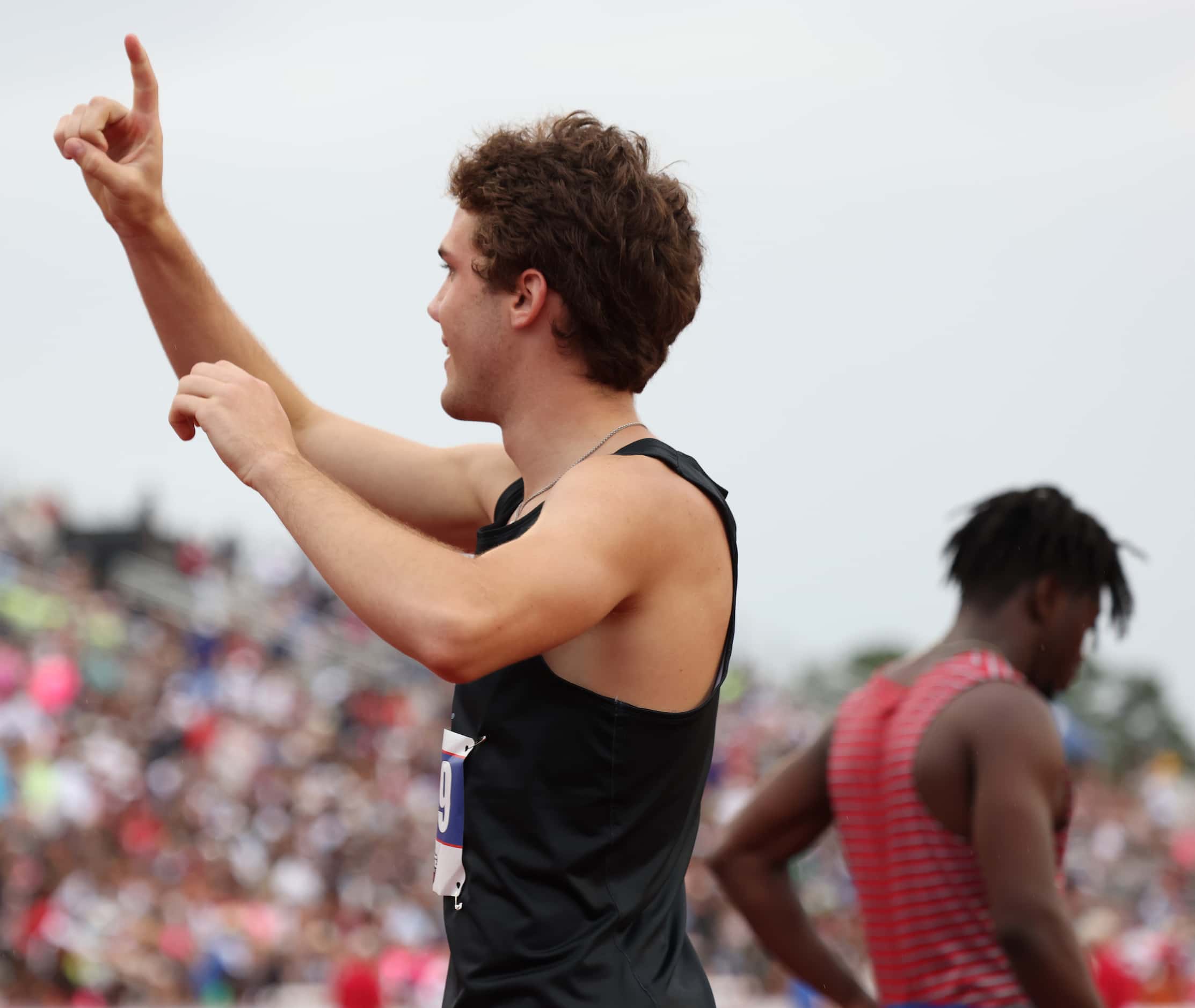 Coppell's Aidan McFarlane gestures to supporters the crowd after finishing the 6A Boys 110...