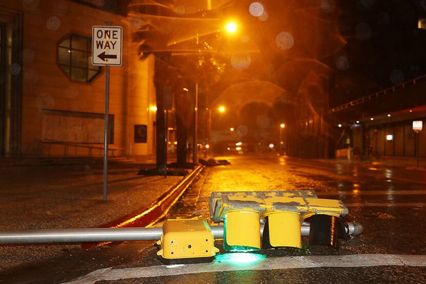 A downed traffic light lays in the street early Friday in Corpus Christi after Hurricane...