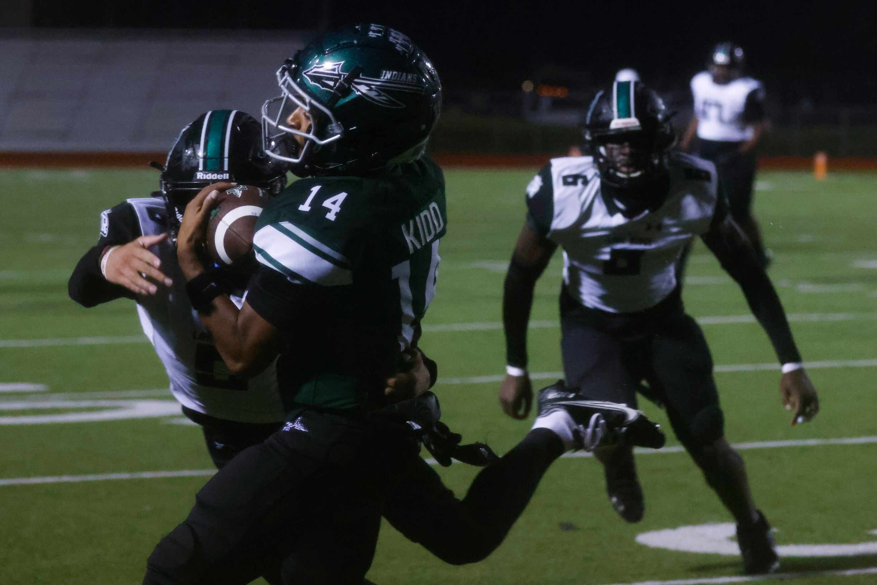 Mansfield Lake Ridge High School’s Michael Spencer (5) tackles Waxahachie High School’s...