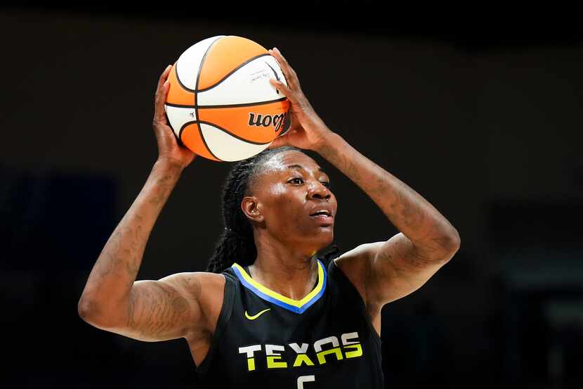 Dallas Wings forward Natasha Howard looks to pass during the second half of a WNBA...