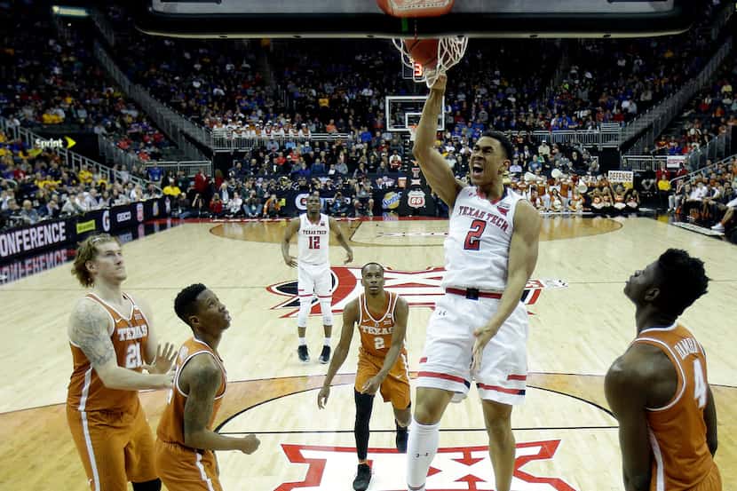 Texas Tech's Zhaire Smith dunks the ball during the second half of an NCAA college...