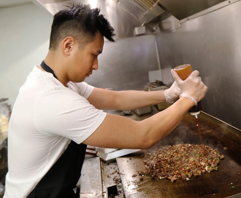 Calvin Nguyen, founder and CEO of OMG Tacos, makes OMG steak tacos, the restaurant's most...