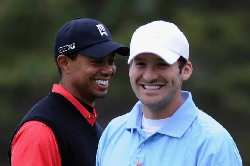 PEBBLE BEACH, CA - FEBRUARY 12:  Tiger Woods (L) and Tony Romo (R), NFL football quarterback...