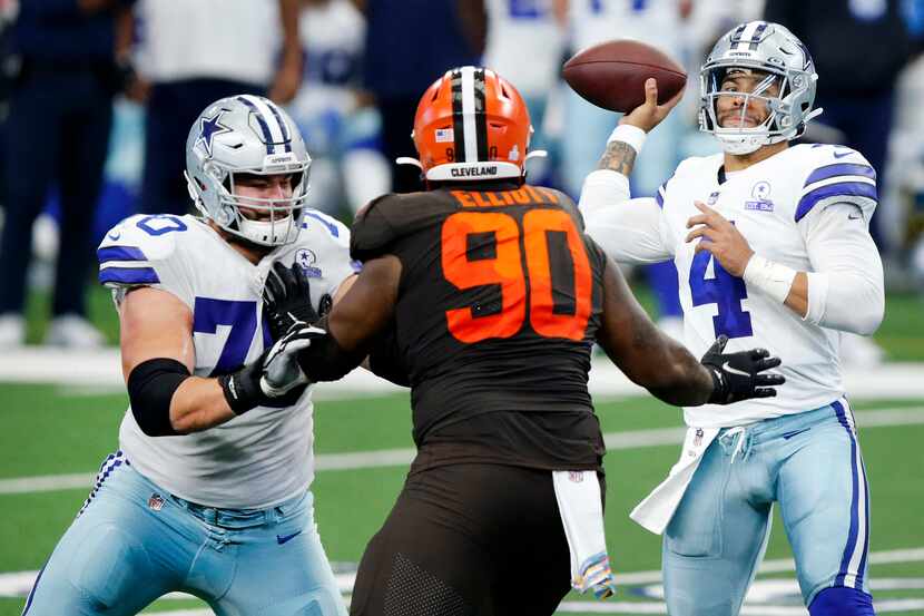 Cowboys guard Zack Martin (70) blocks Browns defensive tackle Jordan Elliott (90) while...