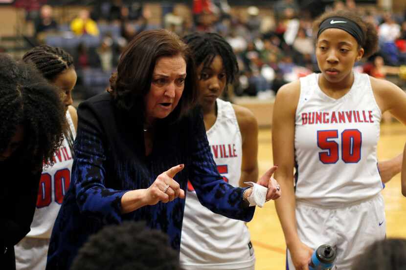 Duncanville head coach Cathy Self-Morgan speaks with her players during a timeout in the...