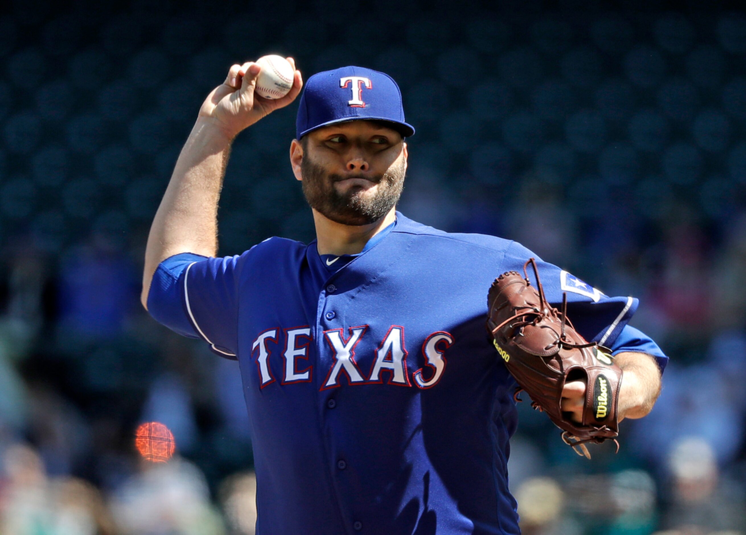 Texas Rangers starting pitcher Lance Lynn throws against the Seattle Mariners in the first...