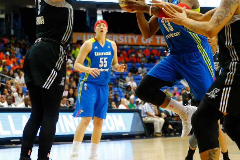 Dallas Wings guard Karima Christmas-Kelly (13) goes up for a shot in front of San Antonio...