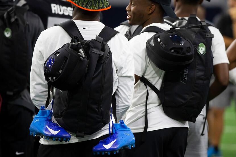Players carry new Nike cleats and backpacks during the third day of The Opening at The Star...