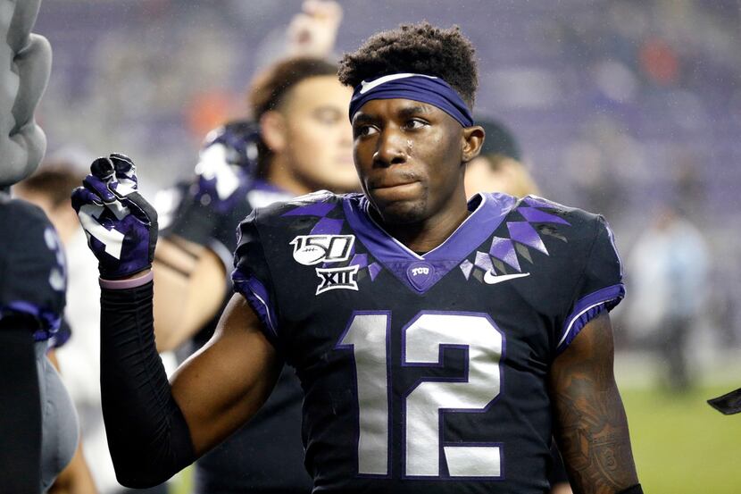 TCU Horned Frogs senior cornerback Jeff Gladney (12) joins his teammates in the school song...