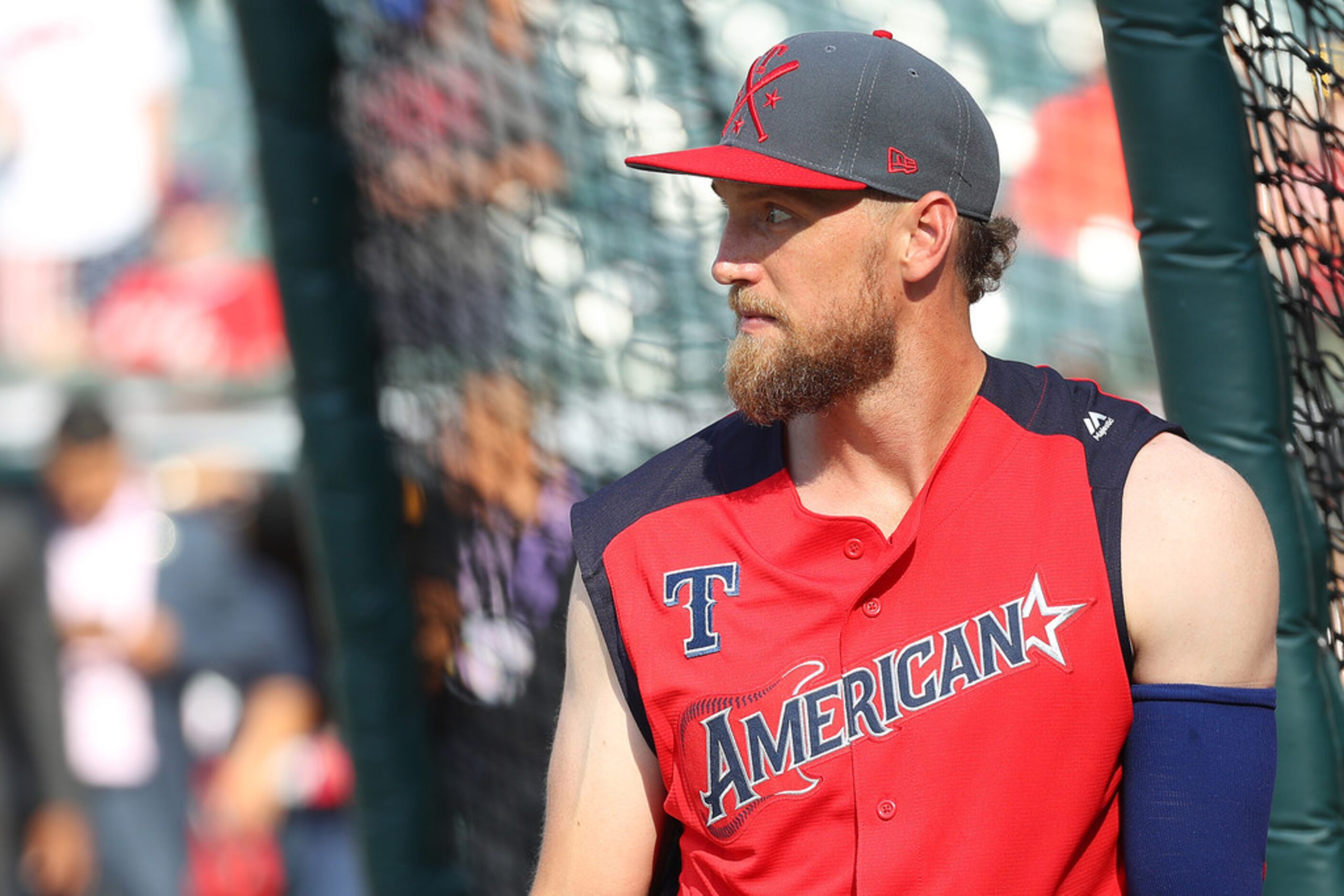 CLEVELAND, OHIO - JULY 09: Hunter Pence #24 of the Texas Rangers warms up prior to the 2019...