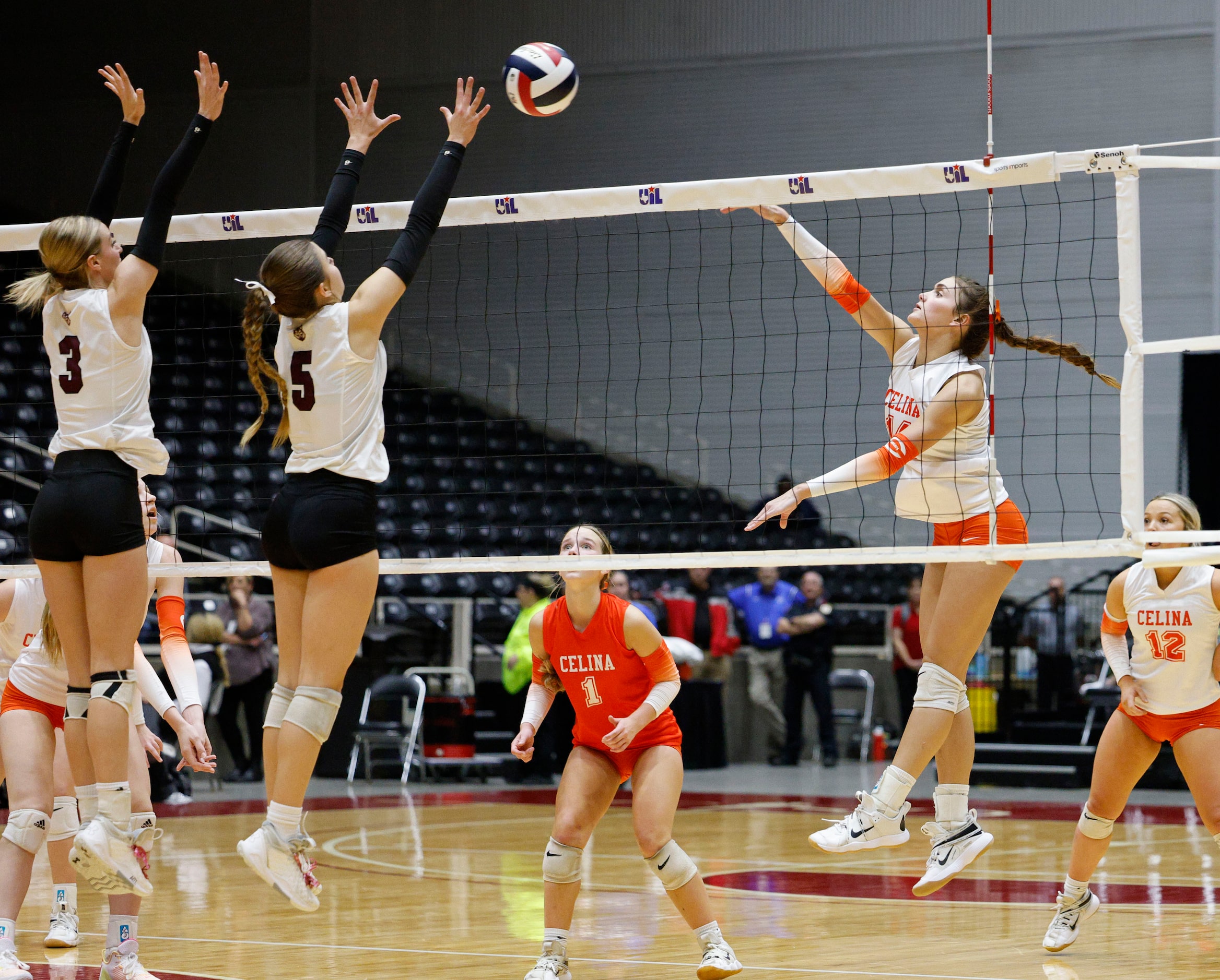 Comal Davenport's Ryan Kovacs (3) and Comal Davenport's Comal Davenport's Lexi Dahl (5) try...