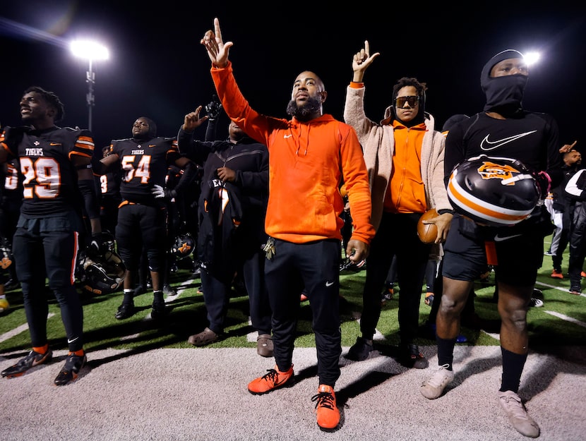 Lancaster head coach Leon Paul and his team celebrate his first playoff win with a 35-15...