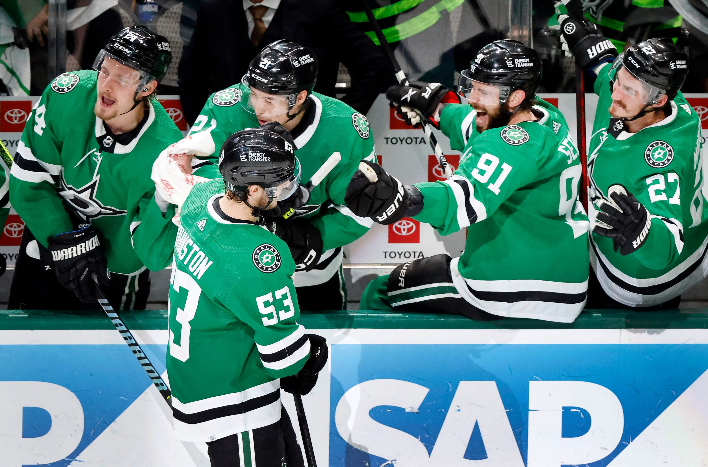 Dallas Stars center Wyatt Johnston (53) is congratulated by teammates Roope Hintz (24),...