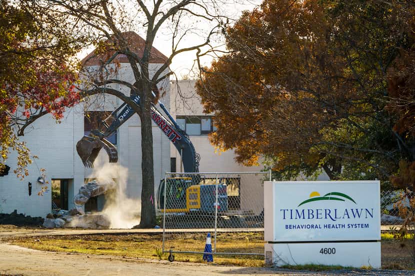 Crews work on the demolition of the Timberlawn Behavioral Health System hospital campus at...