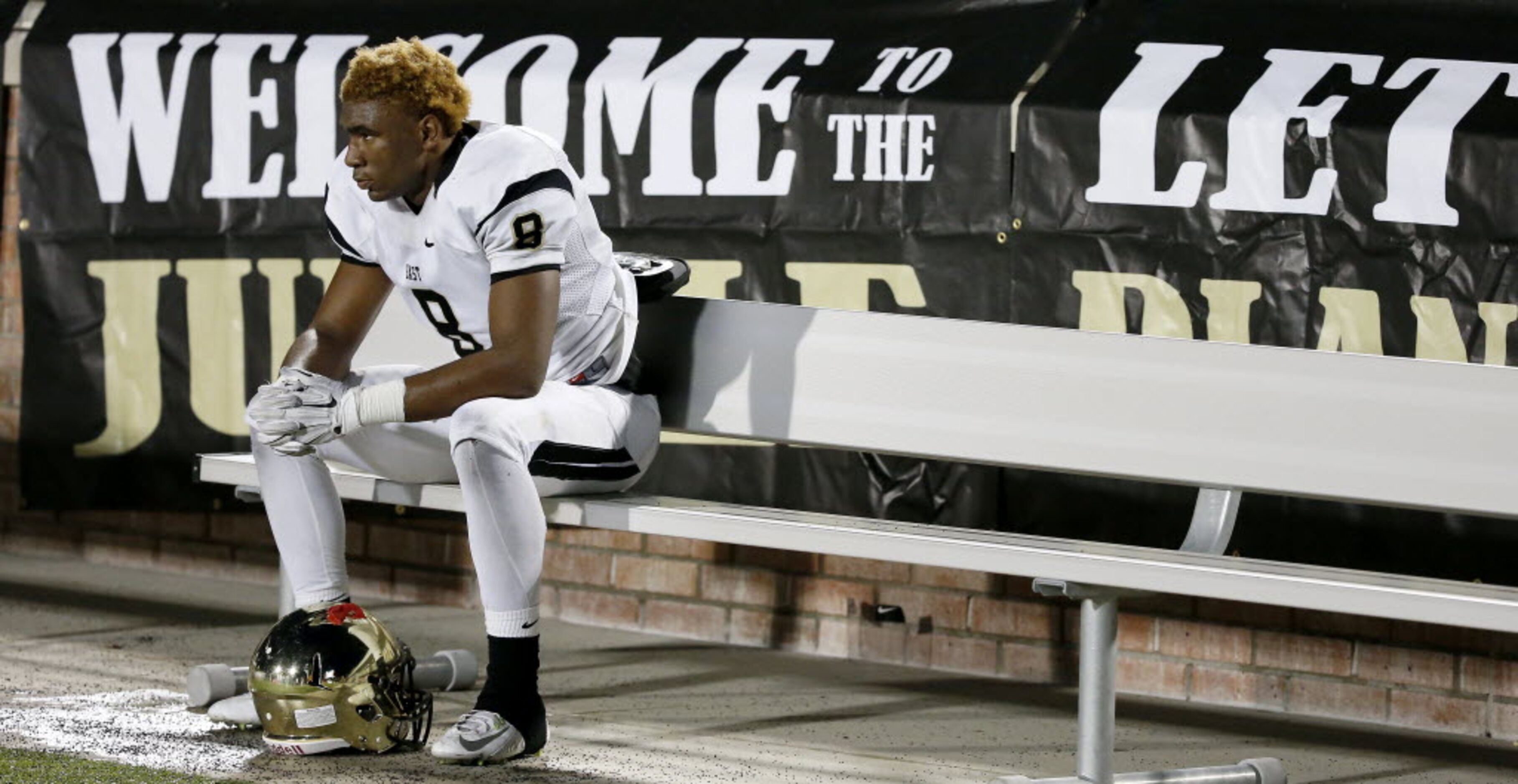 Plano East's Reuben Donald (8) sits on the bench in the last seconds of the second half...