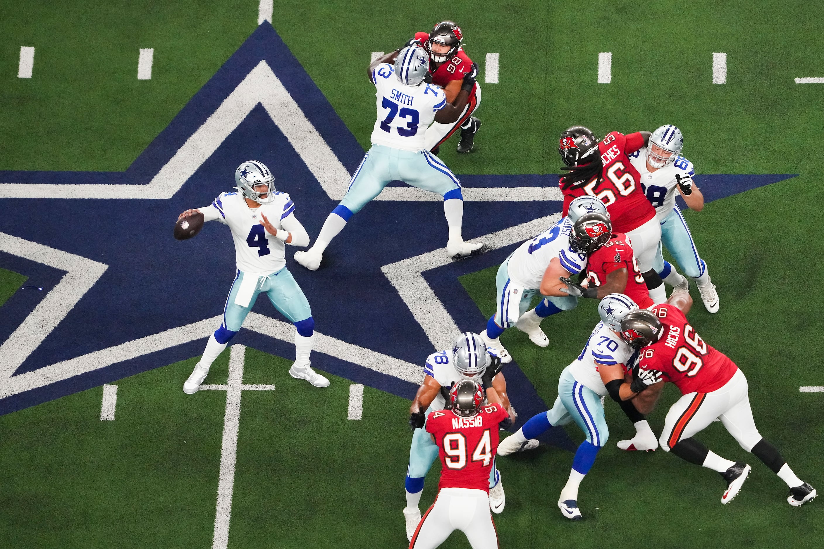 ARLINGTON, TX - SEPTEMBER 11: Dallas Cowboys Quarterback Dak Prescott (4)  looks to throw the ball downfield during the Tampa Bay Buccaneers-Dallas  Cowboys regular season game on September 11, 2022 at AT&T