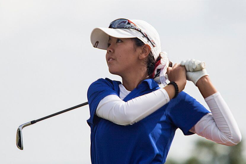 Grapevine's Anna Takahashi tees off at hole 4 during the UIL state girls 5A meet at the...
