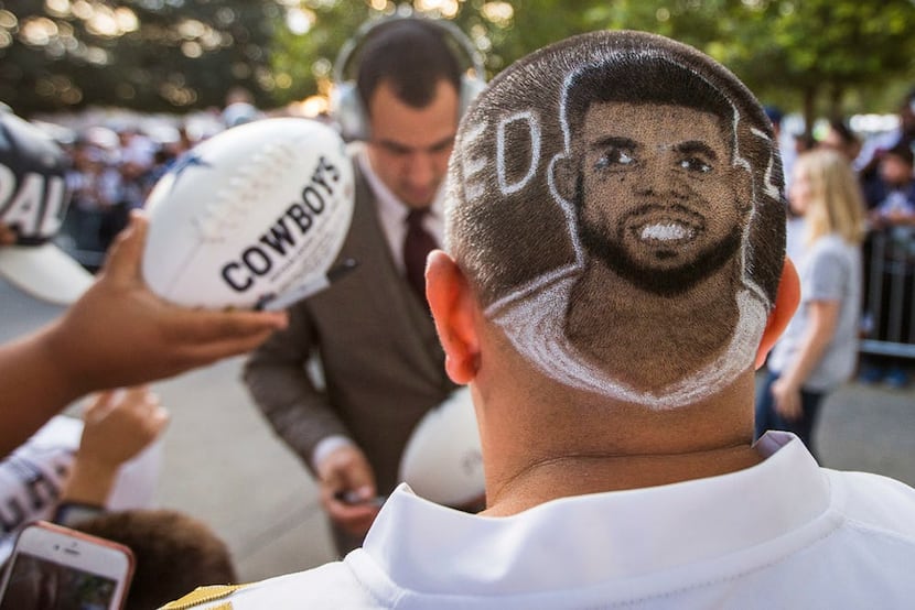 Dallas Cowboys fan Juan Ramirez of San Antonio sports a haircut featuring running back...