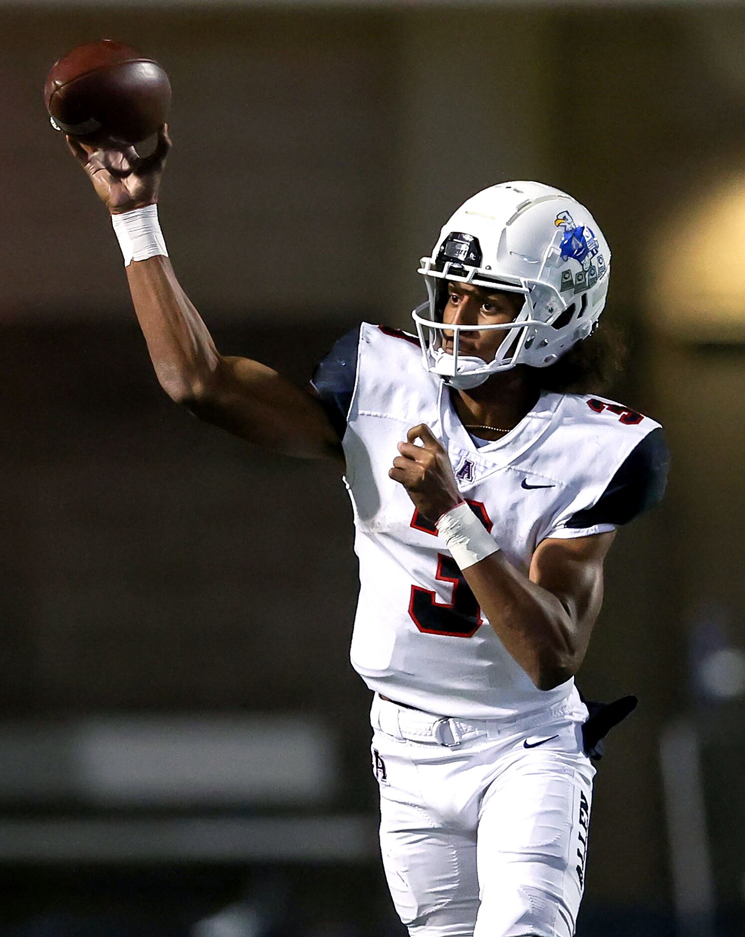 Allen quarterback Mike Hawkins attempts a pass against Denton Guyer during the first half in...
