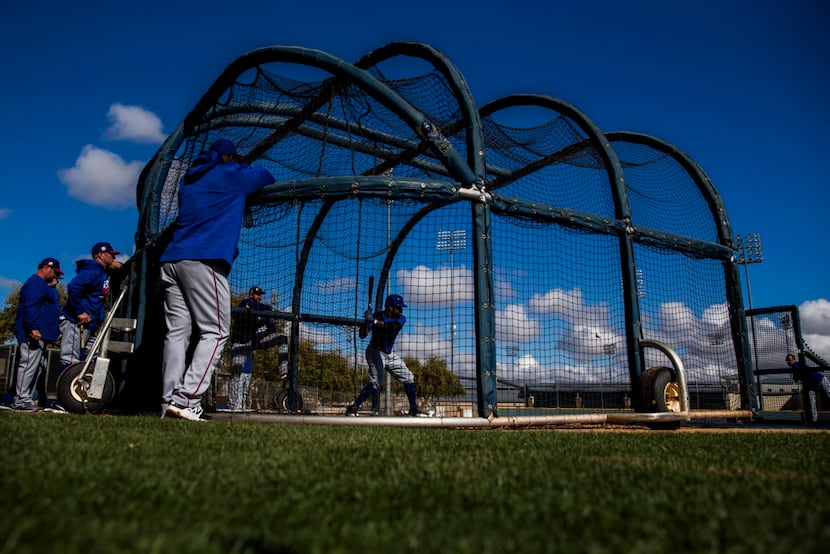 Texas Rangers center fielder Delino DeShields (3) bats during a spring training workout at...