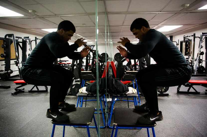 Mansfield Legacy football player Jalen Catalon works out in the weight room on Thursday,...