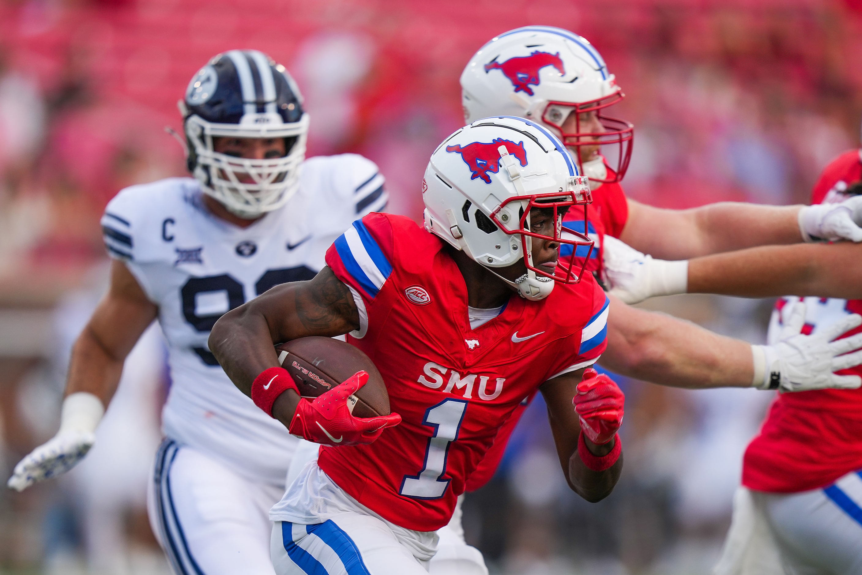 SMU running back Brashard Smith (1) carries the ball during the first half of an NCAA...