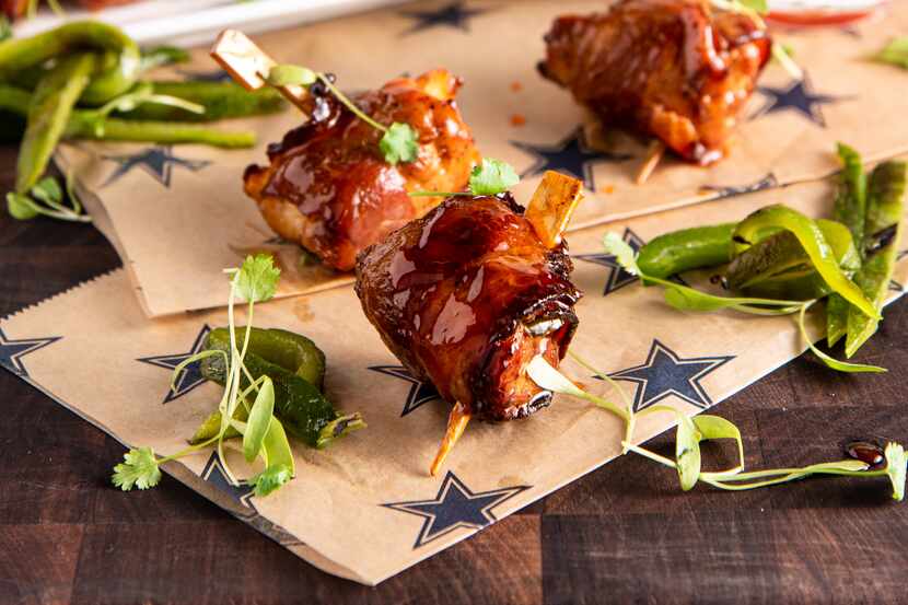 AT&T Stadium's bacon-wrapped jalapeño chicken bites are included in one of several packages...