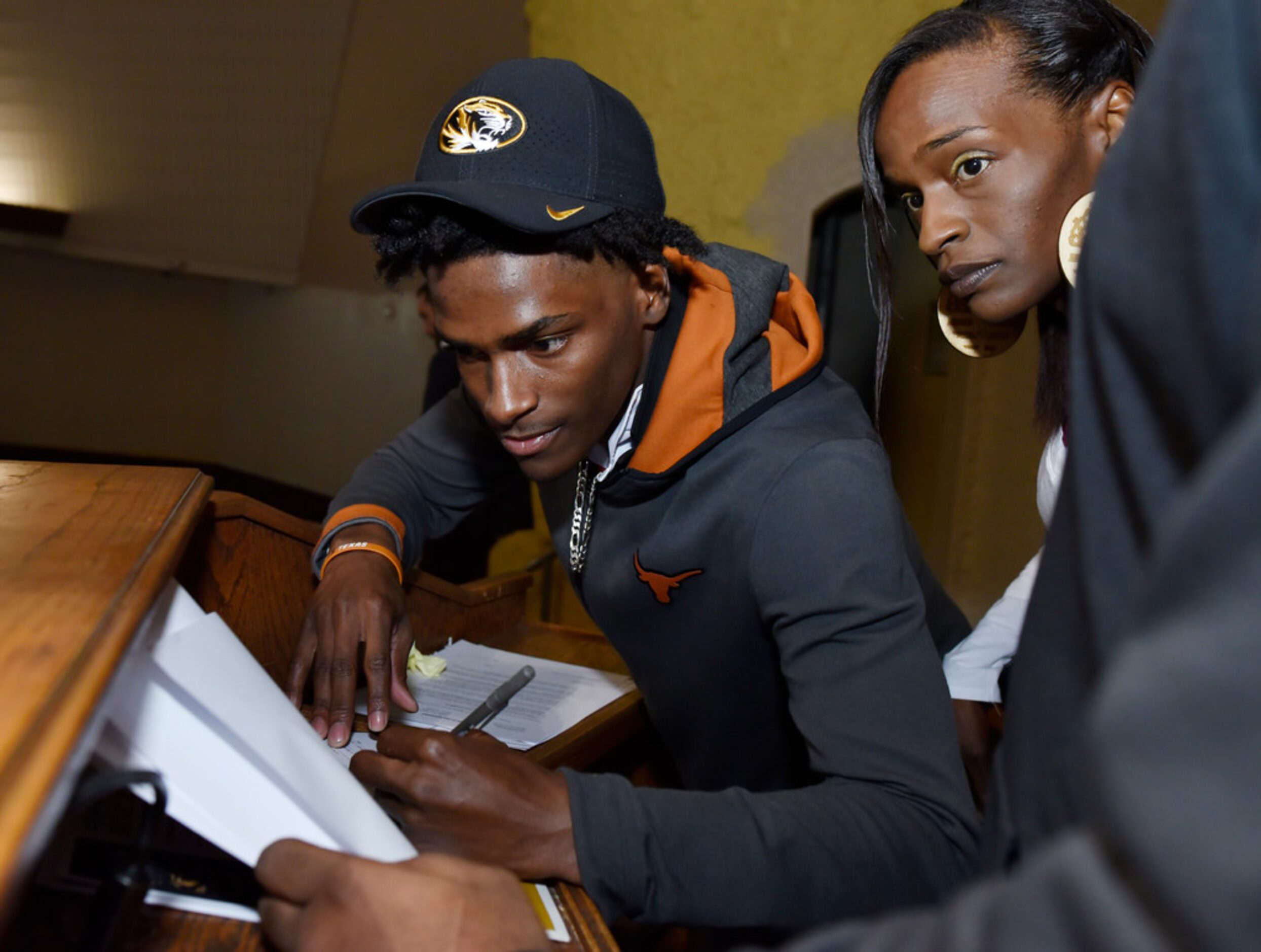 Duncanville cornerback Ennis Rakestraw, Jr., left, while wearing a University of Missouri...