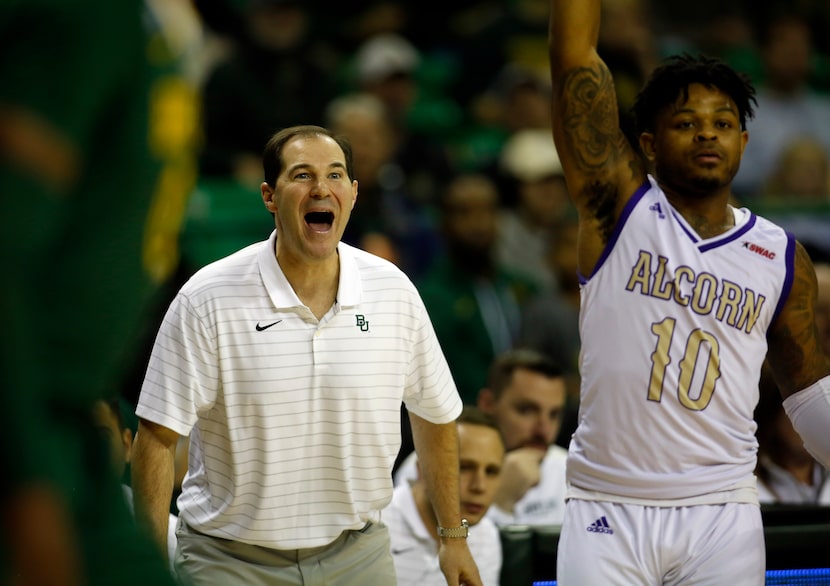 Baylor head coach Scott Drew reacts following a defensive block during first half action...