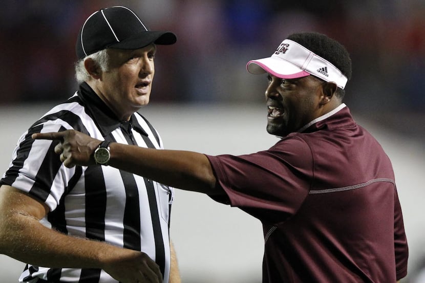 Texas A&M Aggies head coach Kevin Sumlin questions a call with an official during the first...