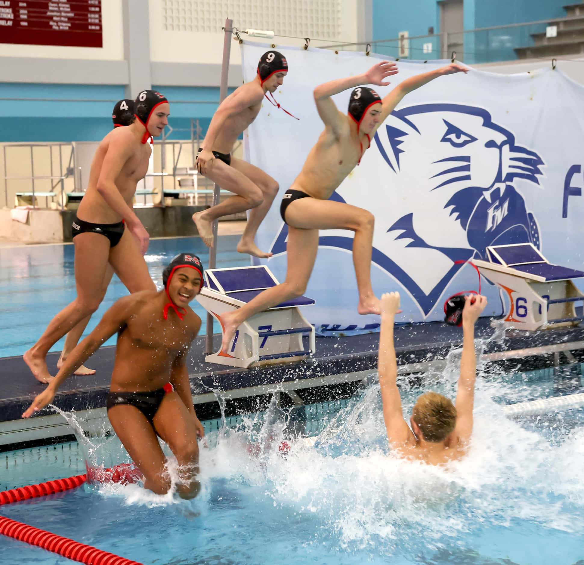 Flower Mound Marcus celebrates their victory by jumping back into the pool after beating...