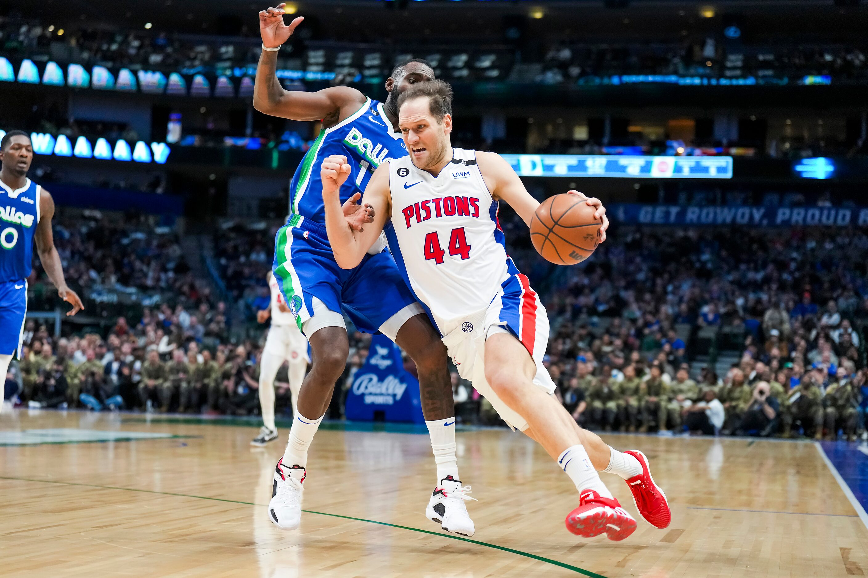 Detroit Pistons forward Bojan Bogdanovic (44) drives past Dallas Mavericks forward Tim...