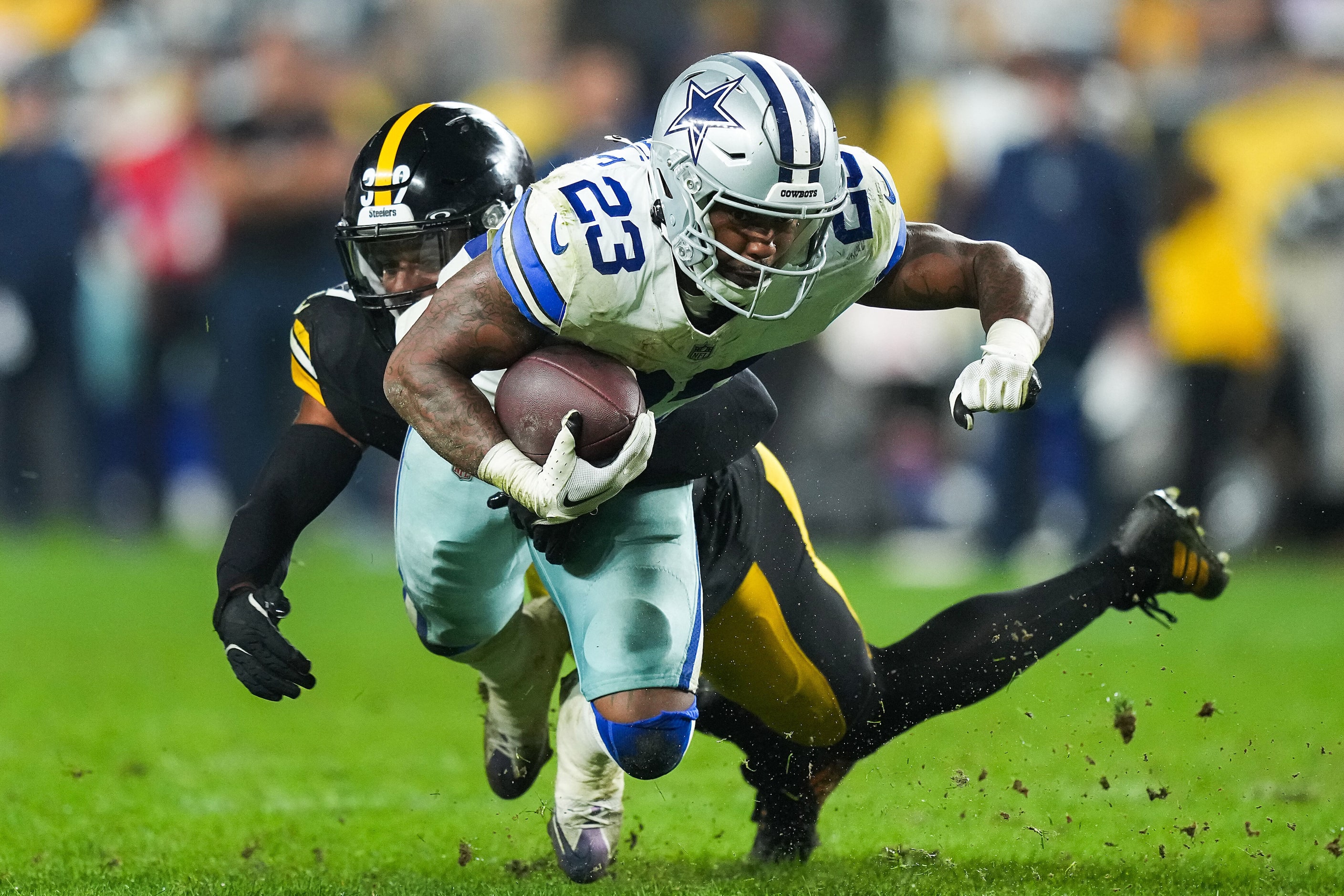 Dallas Cowboys running back Rico Dowdle (23) dives for extra yardage past Pittsburgh...