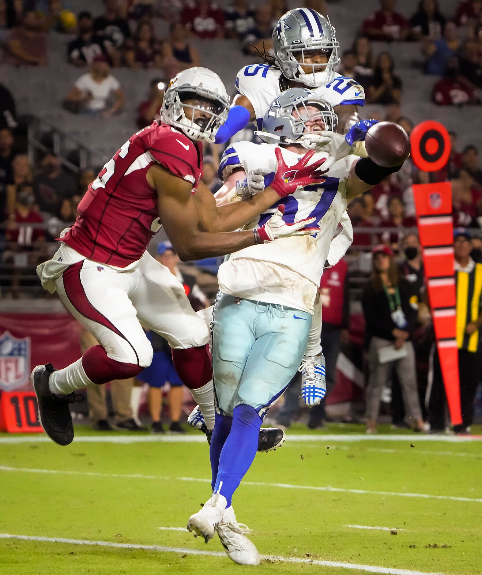 Dallas Cowboys linebacker Luke Gifford (57) and safety Steven Parker (25) break up a pass...