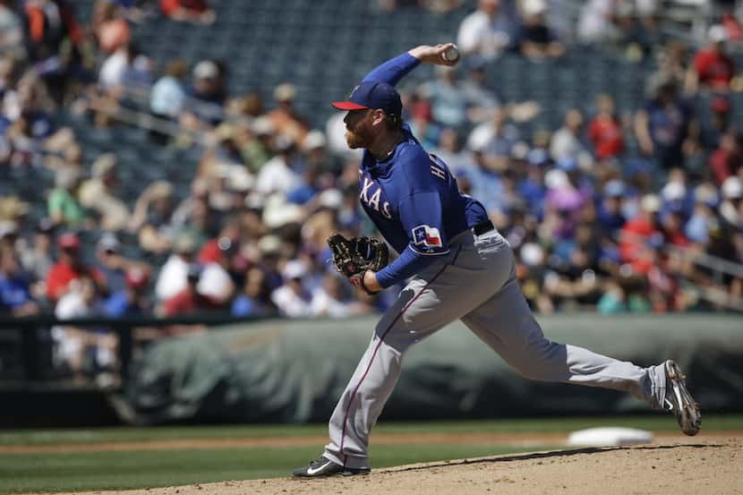 Texas Rangers' Tommy Hanson throws during against the Kansas City Royals a spring exhibition...
